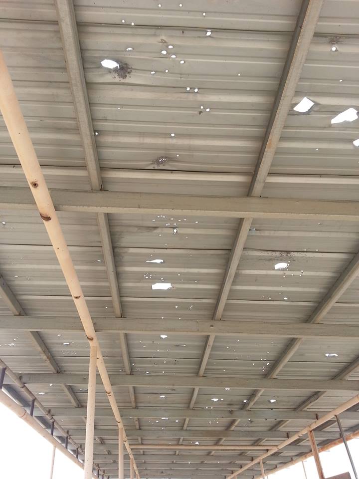 The roof/sunshade over the public range in Casa Grande, Arizona. Whether these holes are the result of negligence, willful destruction of property, or a combination of both is almost irrelevant. Any combination of the above is terrifying.